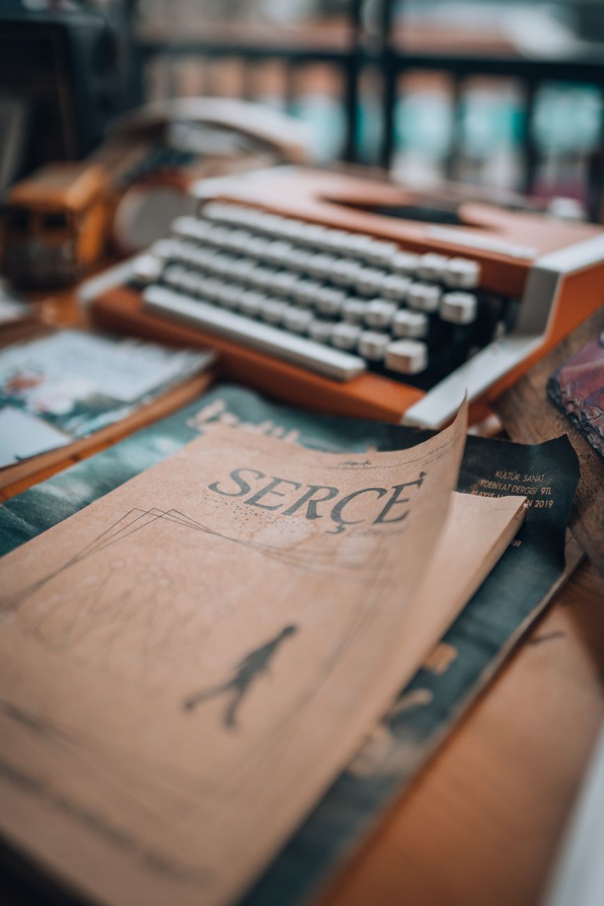 antique book and typewriter